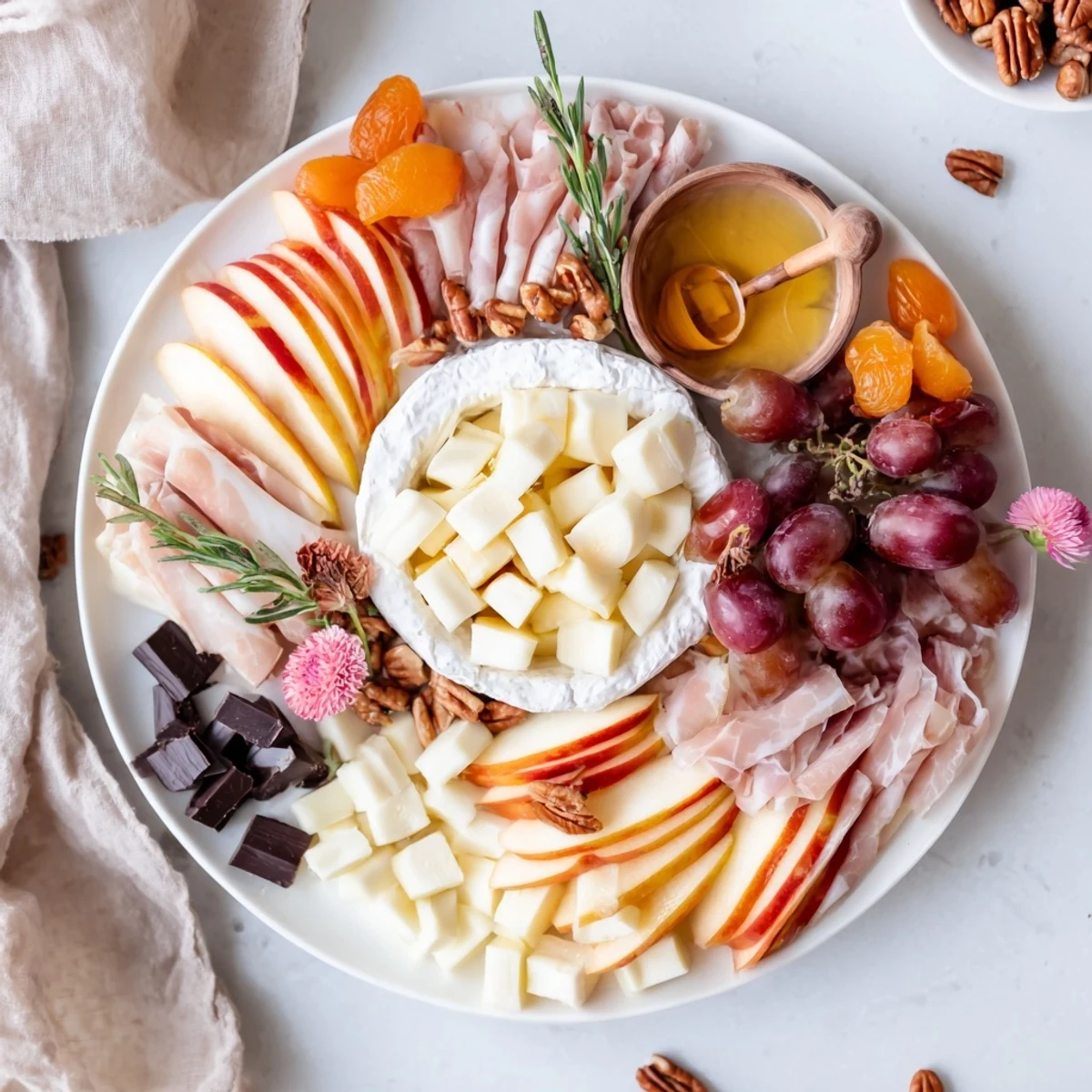 This Sweet Home Charcuterie Board features an inviting spread of cheeses, fruits, and treats for easy sharing.
