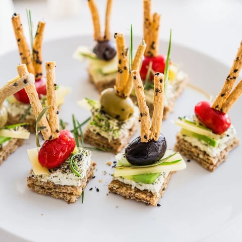 Delicious Urban Skyscraper Appetizers, beautifully arranged with cheeses, veggies, and crackers on a platter.