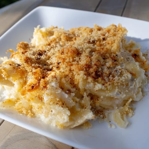 Delicious Effortless Sauerkraut Casserole, layered with potatoes and cheese, ready for serving during dinner.